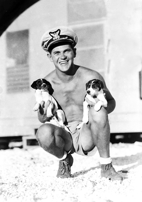 Ltjg Sopko with station puppies circa 1944-1945